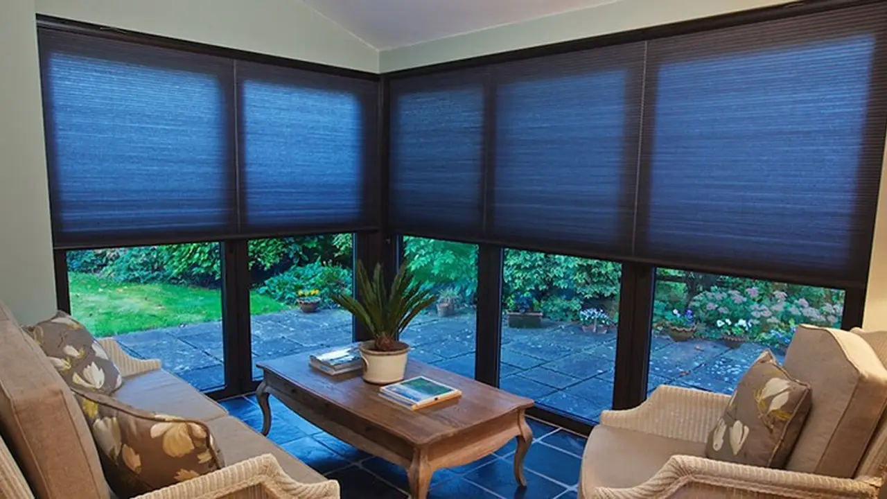 Close up on a plate of mashed potatoes, topped with baked pork chops with cream of mushroom soup, and a side of green beans.