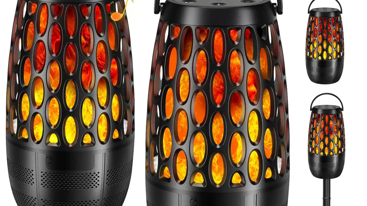 Close up on a plate of mashed potatoes, topped with baked pork chops with cream of mushroom soup, and a side of green beans.