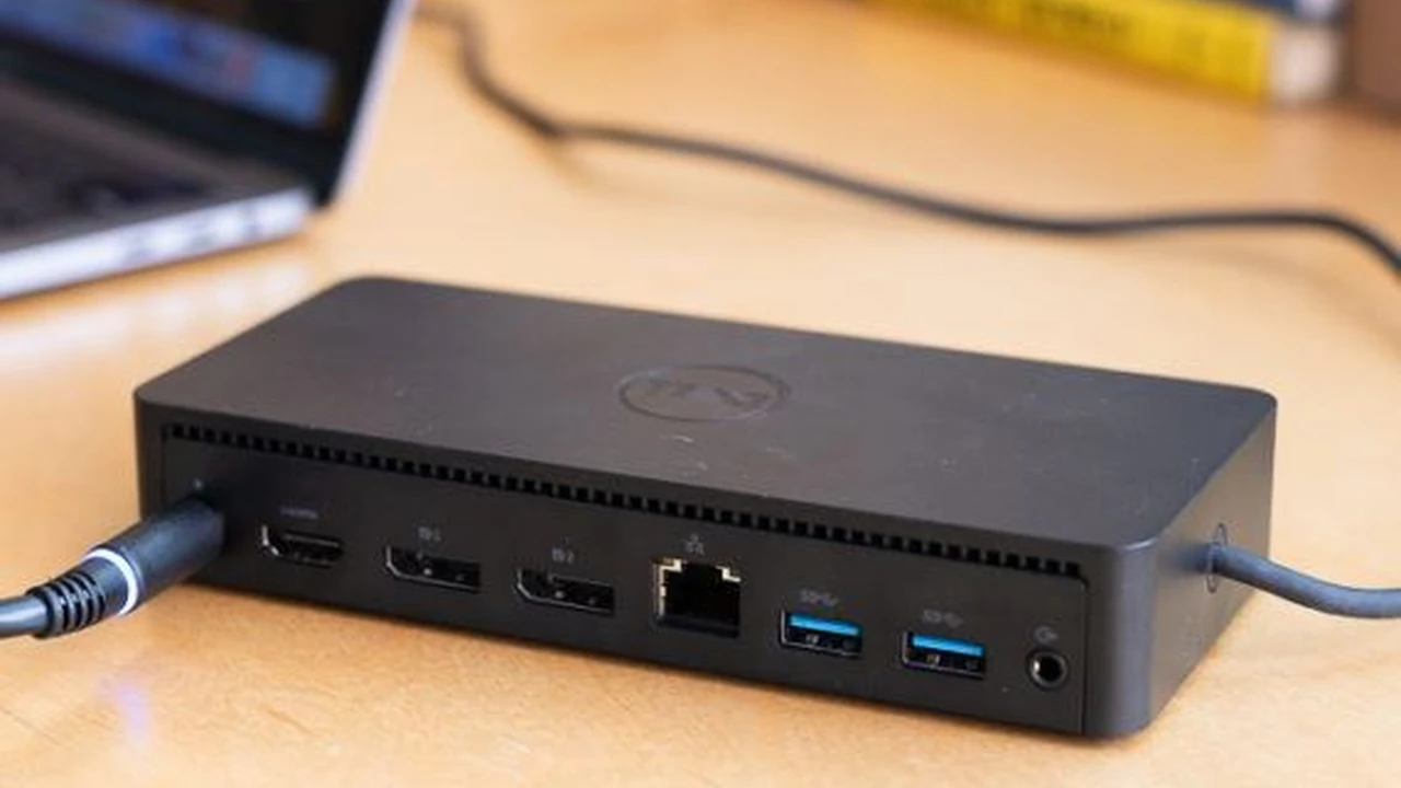 Close up on a plate of mashed potatoes, topped with baked pork chops with cream of mushroom soup, and a side of green beans.